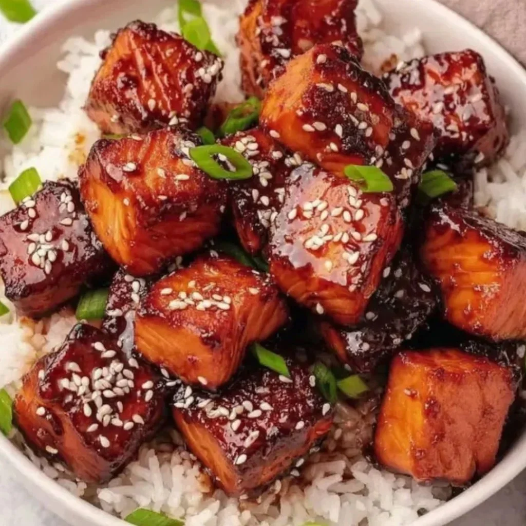 Honey Garlic Salmon Bites Bowl topped with fresh herbs and served in a bowl.