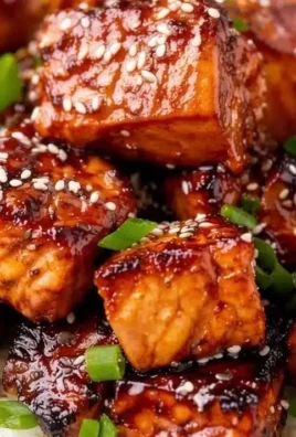 Honey Garlic Salmon Bites Bowl with vibrant vegetables and rice.