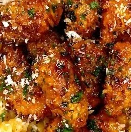 Hot Honey Chicken Pasta garnished with herbs and served in a bowl