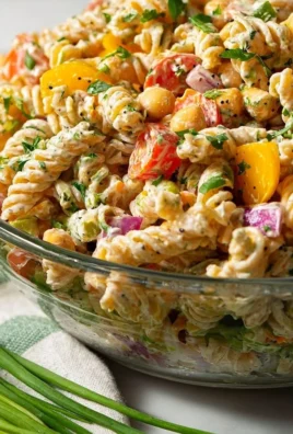 High protein vegan pasta salad with colorful vegetables and dressing