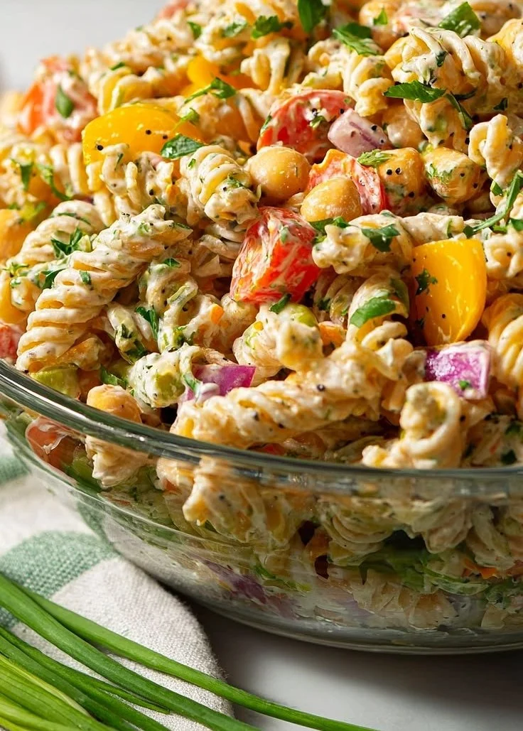 High protein vegan pasta salad with colorful vegetables and dressing