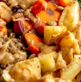Colorful Lentil Nourish Bowl filled with fresh vegetables and herbs
