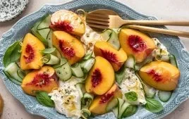 Fresh Peach Caprese Salad with Burrata cheese, basil, and vibrant colors.