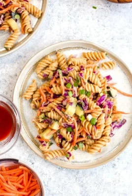 Protein Packed Thai Pasta Salad with colorful vegetables and herbs.