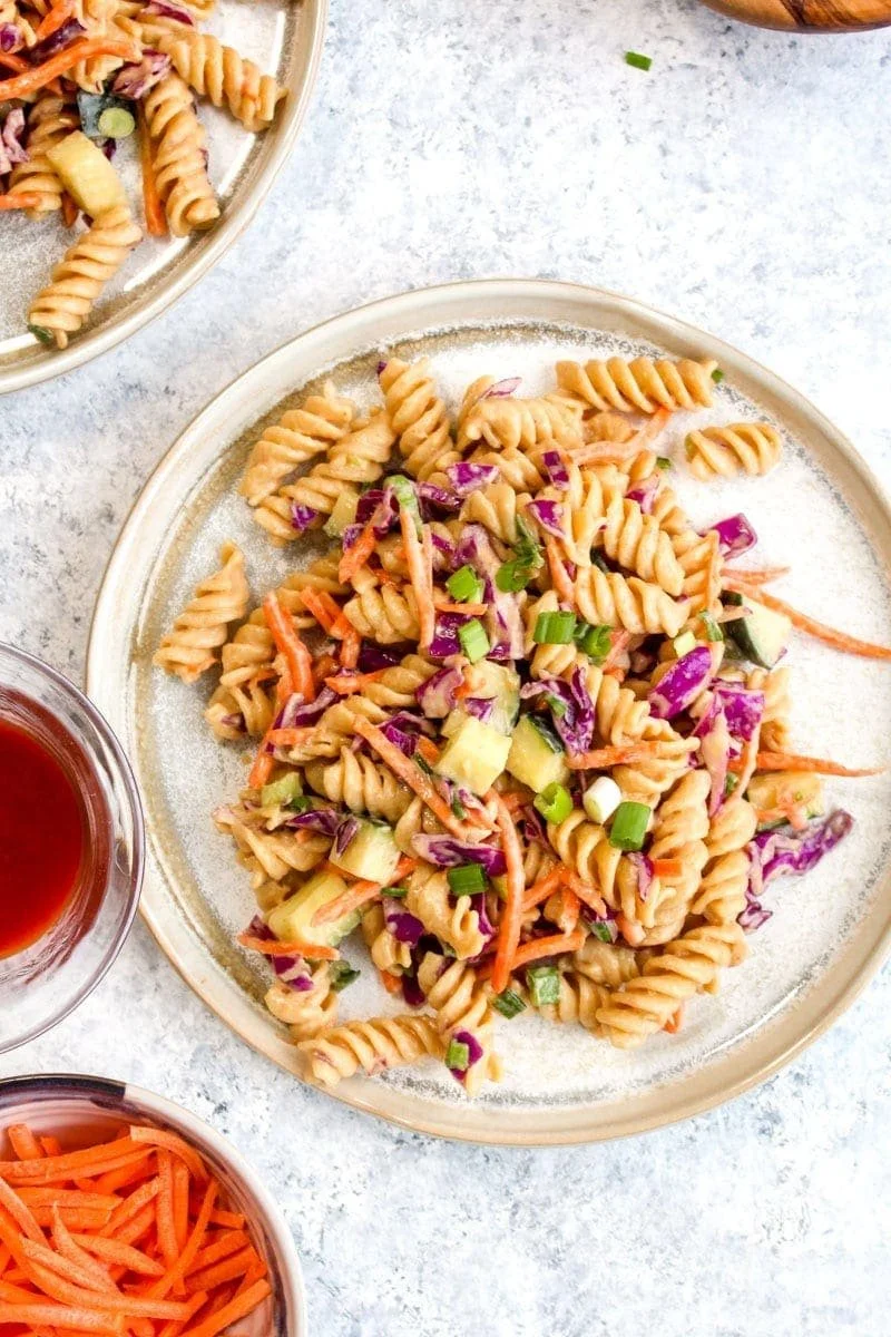 Protein Packed Thai Pasta Salad with colorful vegetables and herbs.