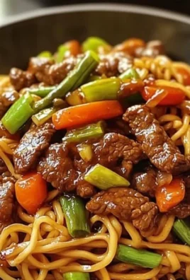 Delicious teriyaki beef stir-fry served with noodles on a plate