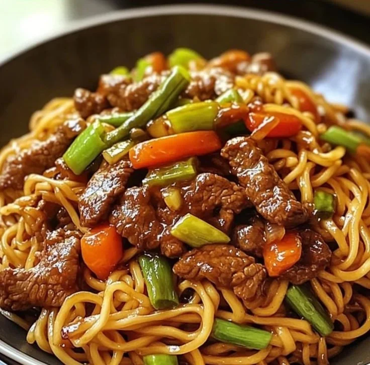 Delicious teriyaki beef stir-fry served with noodles on a plate