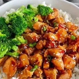 Delicious Teriyaki Chicken Rice Bowl with vibrant vegetables and rice.