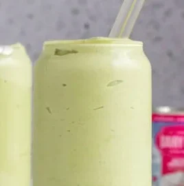 A refreshing Vietnamese avocado smoothie served in a glass with mint leaves.