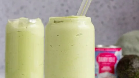 A refreshing Vietnamese avocado smoothie served in a glass with mint leaves.