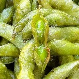 Delicious air fryer edamame served in a bowl, healthy snack option.