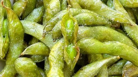 Delicious air fryer edamame served in a bowl, healthy snack option.