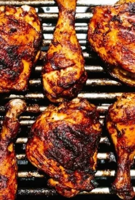 Grilled BBQ chicken served with vibrant sides for a perfect summer meal.