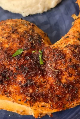 Delicious oven baked chicken quarters garnished and ready to serve.