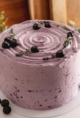 Delicious Blueberry Chiffon Cake with fresh blueberries and whipped cream