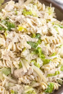 A delicious bowl of Chicken Caesar Pasta Salad featuring pasta, chicken, and Caesar dressing