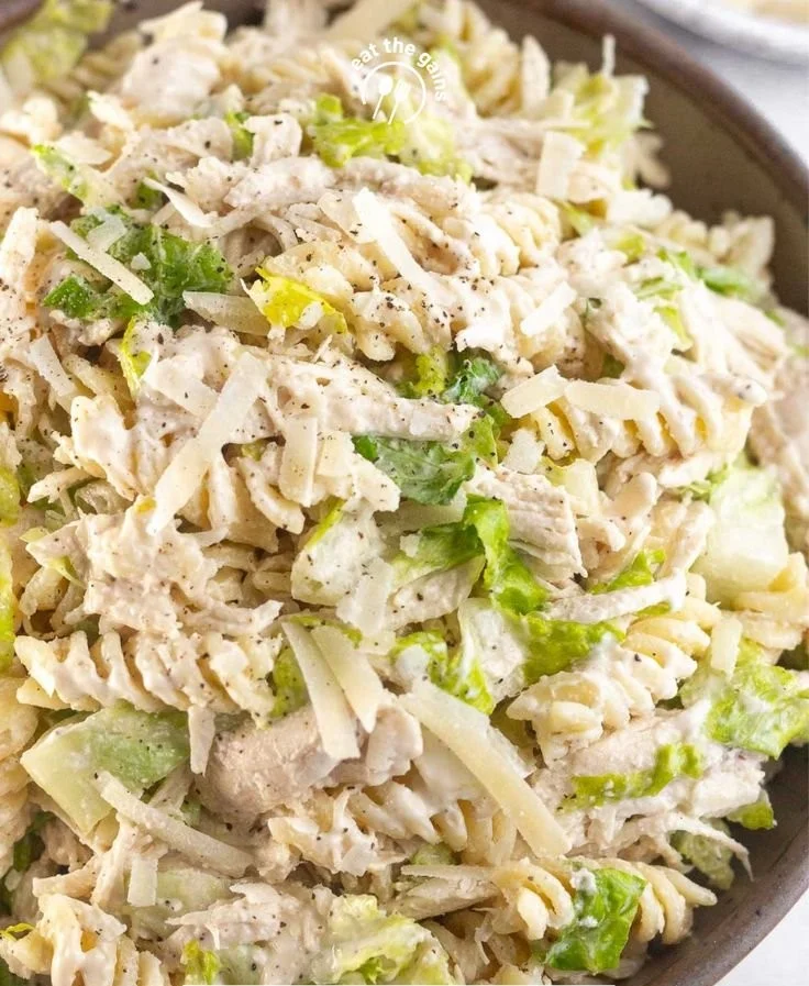 A delicious bowl of Chicken Caesar Pasta Salad featuring pasta, chicken, and Caesar dressing