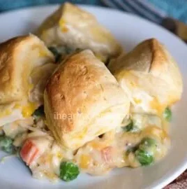 Delicious Chicken Pot Pie with flaky biscuits, hearty filling of chicken and vegetables.
