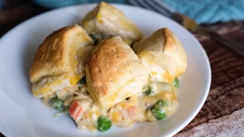 Delicious Chicken Pot Pie with flaky biscuits, hearty filling of chicken and vegetables.