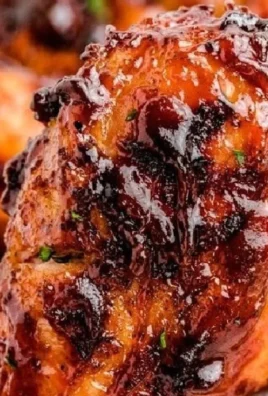 Deliciously grilled BBQ chicken with smoky flavor and glossy sauce on a platter.