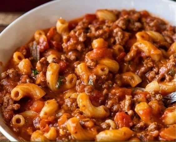 Plate of delicious ground beef goulash with pasta and vegetables
