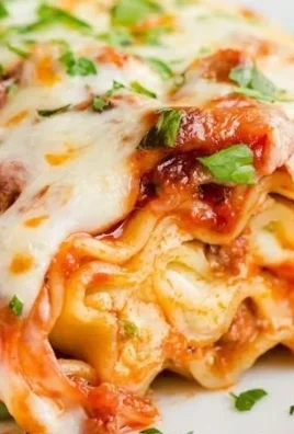 Delicious lasagna roll-ups filled with cheese and sauce served on a plate