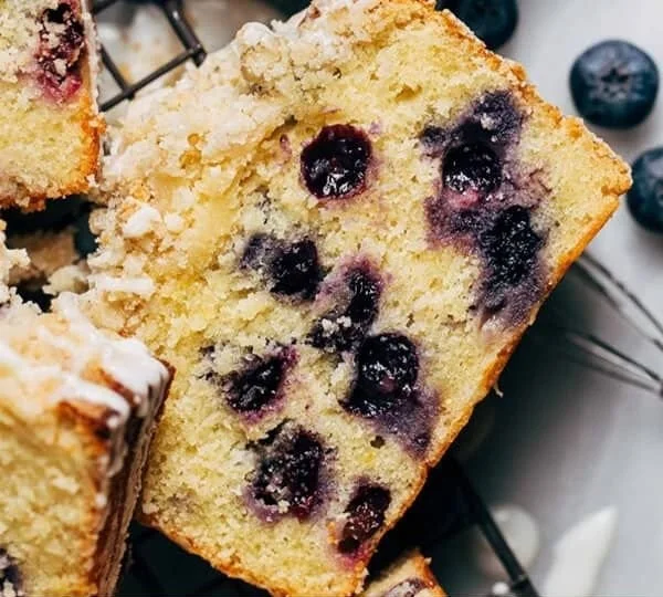 Freshly baked lemon blueberry loaf with a golden crust and vibrant blueberries