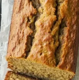 Moist and healthy banana bread slices on a wooden table