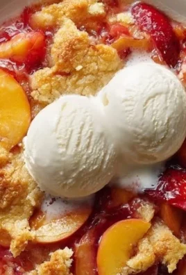 Delicious Peach Strawberry Cobbler served in a baking dish
