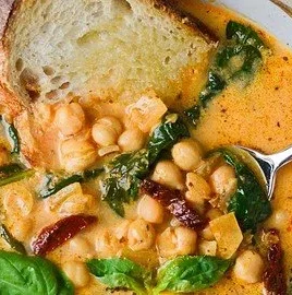 Bowl of Tuscan Garbanzo Bean Soup with fresh herbs and vegetables